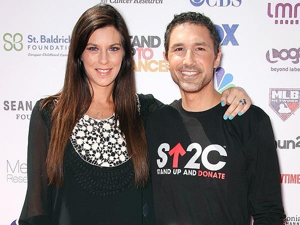 Picture of Jenna Morasca with her former boyfriend Ethan Zohn posing for a photoshoot wearing black dress